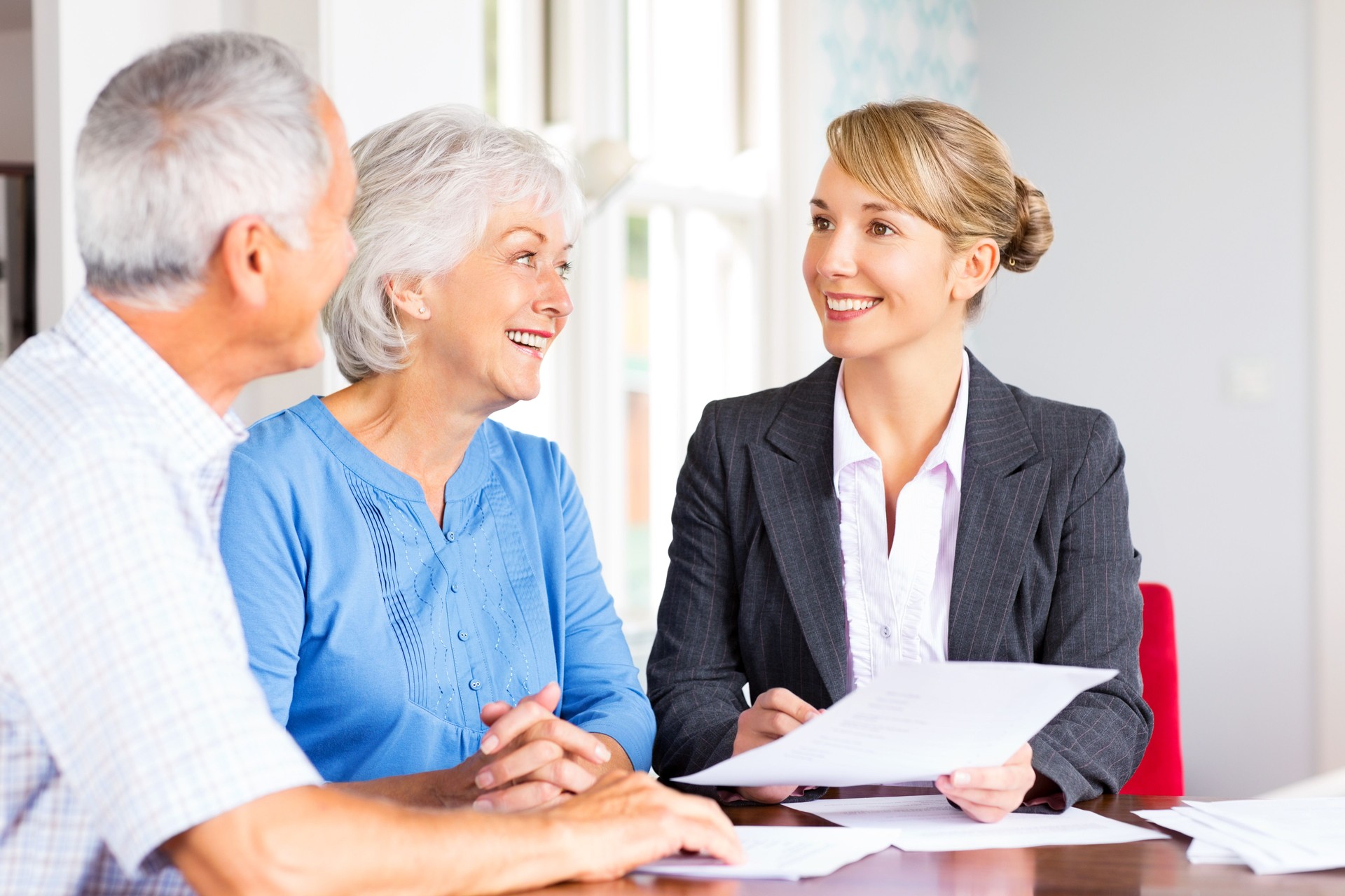 Senior Couple Discussing Finances With Advisor.